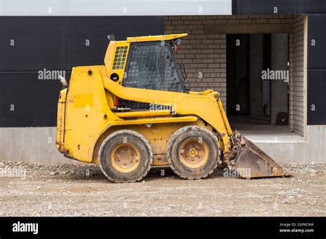 yellow bobcat skid steer|Skid.